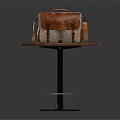 Vintage Brown And Beige Leather Bag On Wooden Round Table With Metal Base
