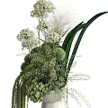 Elegant Decorative Ornament Arrangement With Lush Green Foliage White Flowers And Spherical Plants