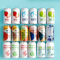 Vibrant Fruit Beverage Cans with Various Flavors on Light Blue Background 3d model