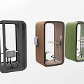 Three Colored Soundproof Office Pods With Desk And Chair Setup