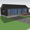 Wooden House With Black Roof Large Windows Blue Curtains Green Lawn And Covered Deck