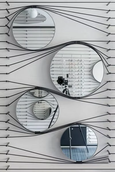 Creative Circular Mirrors Connected By Black Lines Hanging On White Background 3d model