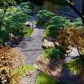 Tranquil Courtyard Garden With Stone Pathway Lush Greenery Autumn Trees And Flowing Stream