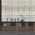 Modern Bar Counter Design with Hanging Lights Wine Bottles and Blue Stools