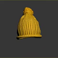 Yellow Knit Beanie With Pom Pom Top And Ribbed Texture On Dark Background