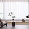 White Vertical Blinds In Modern Living Room With Armchair Table Plant And Lamp