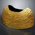 Ancient Golden Ornament With Intricate Patterned Design And Shiny Detailed Surface