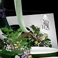 Modern Garden Landscape Design With Green Plants Flowers White Backdrop And Black Letter Decoration