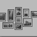 Stylish Black Framed Photo Wall With Irregular Arrangement And Black And White Landscape Building