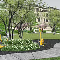 Residential Landscape Entry Featuring Curved Driveway Greenery Water Features And Canopy Covered Walkway