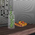 Clear Glass Bottle With Green Plant And Plate Of Peaches On Wooden Tabletop