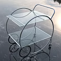 Modern Side Table With Chrome Metal Frame And Glass Shelves On Wheels