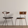 Two Modern Dining Chairs With Wooden Backrests Black Padded Seats And Metal Legs