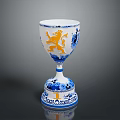 Intricate Sculpted Ceramic Goblet With Blue White Patterns And Orange Lion Design
