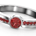 Exquisite Silver Ring Featuring Central Red Gemstone and Small Red Stones Inlaid Band