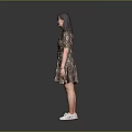 Woman in Gold Sequin Dress Standing Against Gray Background with White Sneakers