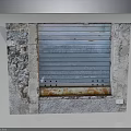 Rustic Furniture Cabinet With Stone Sides And Blue Metal Roller Shutter