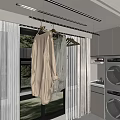Modern Laundry Room Interior With Hanging Clothes On Rack And Washer Dryer