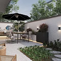 Stylish Outdoor Garden Decor in Walled Space with Umbrella Dining Set Wall Lights and Greenery