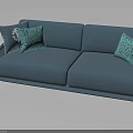 Modern Blue Sofa With Turquoise Patterned Pillows And Golden Legs