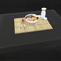 Bowl of Ramen with Pork Slices Soft Boiled Eggs Scallions Chopsticks on Bamboo Mat
