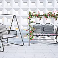Outdoor Swing Chair With Metal Frame Checkered Cushions And Floral Vines In Patio