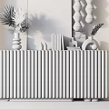 Modern Entryway Console Cabinet With White Vertical Slats Gold Legs And Decorative Plants