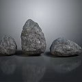 Three Gray Natural Stones with Rough Surfaces and Various Shapes on Reflective Base