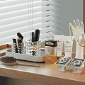 Perfume Cosmetics Display with Makeup Brushes Lotion Tubes and Jewelry on Wooden Vanity Tray