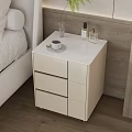 Modern Bedside Table With White Top Drawers Coffee Cup Glass And Perfume Bottles