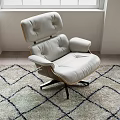 Modern Light Gray Leather Lounge Chair With Wooden Frame On Patterned Area Rug