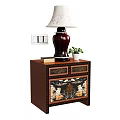 Brown Bedside Table with Floral Carved Drawers Vase Shaped Lamp and Small Potted Plant