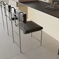 Modern Black Single Chair With Metal Frame And Leather Seat In Interior