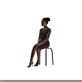 Woman In Dark Lace Dress With Updo Hairstyle Sitting On Wooden Chair In Gray Background
