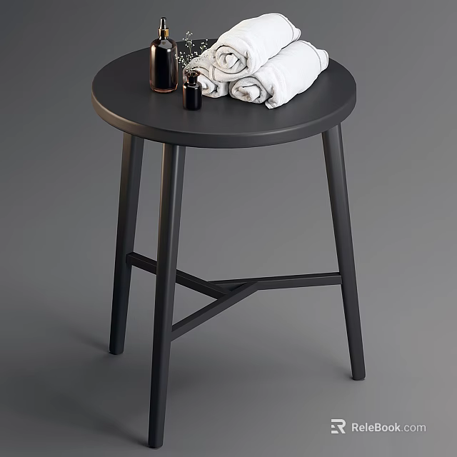 Black Round Side Table With Cross Legs Folded Towels And Scented Bottles 3d model