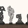 Unique Stone Ornaments on Wooden Surface with Black Bases and Holes