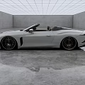 White Convertible Sports Car With Sleek Exterior In Modern Indoor Setting