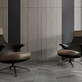 Two Modern Office Chairs With Brown Leather Seats And Black Metal Bases