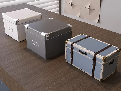 Three Decorative Storage Boxes White Gray Blue With Brown Straps Golden Accents On Wooden Table 3d model