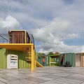 Colorful Container Buildings With Staircase And Service Kiosk In Outdoor Plaza