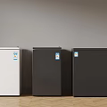 Three Small Refrigerators In White Dark Gray And Black Standing Against Wall On Wooden Floor