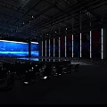 Spacious Indoor Venue With Rows of Chairs Large LED Screen and Central Platform