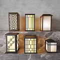 Illuminated Modern Outdoor Lights With Geometric Patterns And Laser Cut Designs On Marble Surface