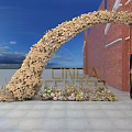 Floral Archway Event Entrance With CINDA CENTER Sign And Red Brick Wall