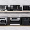 Modern Kitchen Appliances Display With Microwaves And Ovens On Two Shelves