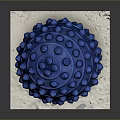 Blue Textured Fitness Massage Ball With Raised Dots On White Paper