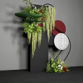 Floral Installation Featuring Black Pillar Greenery Red Blooms Hanging Vines And Red White Textured Circles