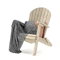 Wooden Leisure Chair With Black And White Polka Dot Blanket And Orange Cushion