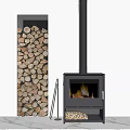 Modern Black Fireplace With Stacked Firewood Beside And Burning Flames Inside