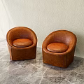 Brown Leather Single Chairs With Rounded Design On Textured Marble Floor And Light Wall 3d model
